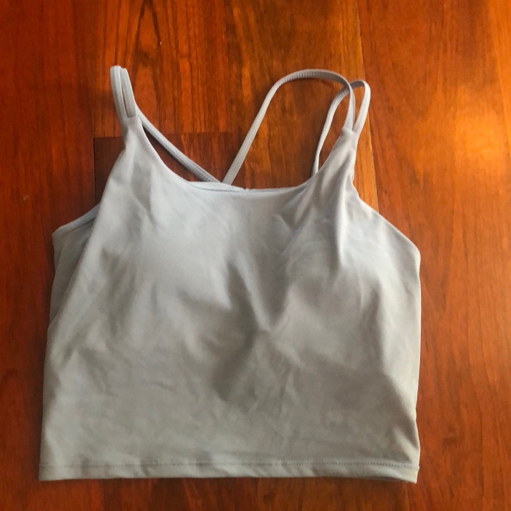 Athletic light blue supportive crop top with crossed straps